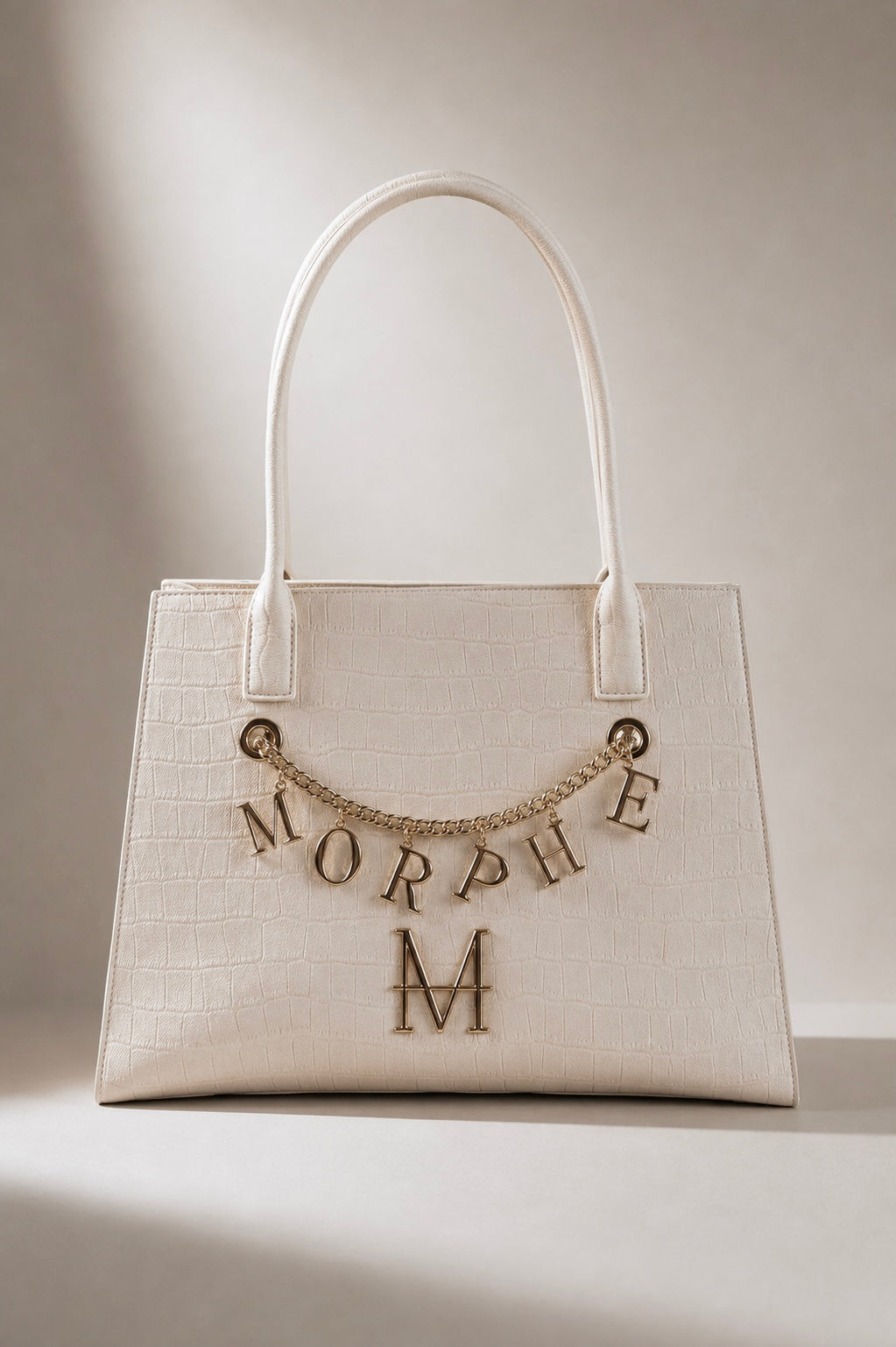 NEPHELE borsa trasformabile MOR/PHE in similpelle color panna con dettagli in oro e charm